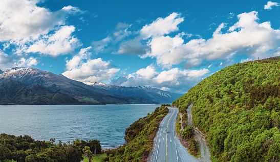 Embark on a breathtaking journey along the picturesque Lake Wakatipu on the road from Queenstown to Glenorchy, New Zealand. Explore stunning landscapes.