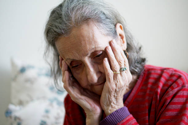 istock Depressed Lonely Senior Woman Covered Her Face With Both Hands 1915741540