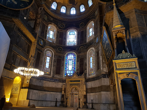 Istanbul, Turkey - September 10, 2010: tourists visiting the interior of Aya Sophia - ancient Byzantine basilica. For almost 500 years the principal mosque of Istanbul, Hagia Sophia served as a model for many other Ottoman mosques