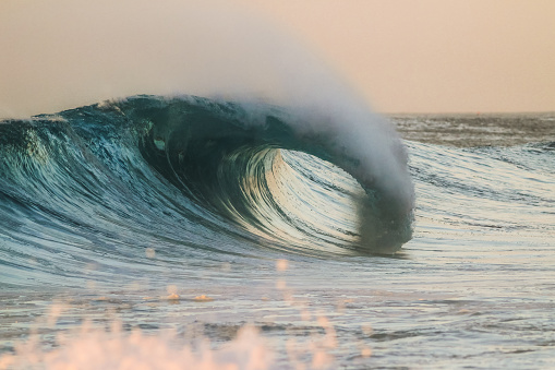 Late afternoon big waves and barrels breaking on the North Shore of Oahu, Hawaii at Backdoor.
