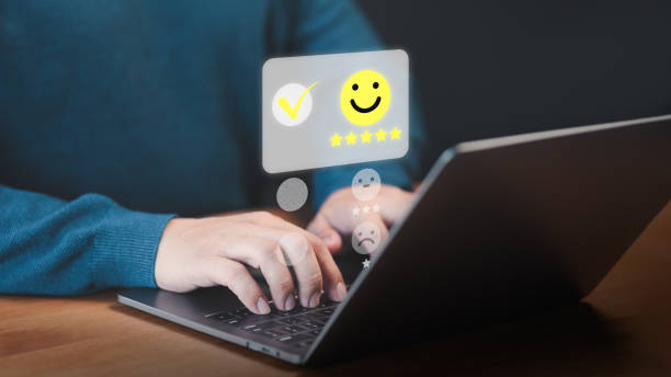 istock User use a laptop give point with virtual screen on smile face icon for satisfaction in opinion and service. Customer satisfaction survey, service rating online, testimonial feedback review. 1915780905