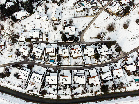 Top down aerial view of a snow covered residential neighborhood near Zalec, Slovenia