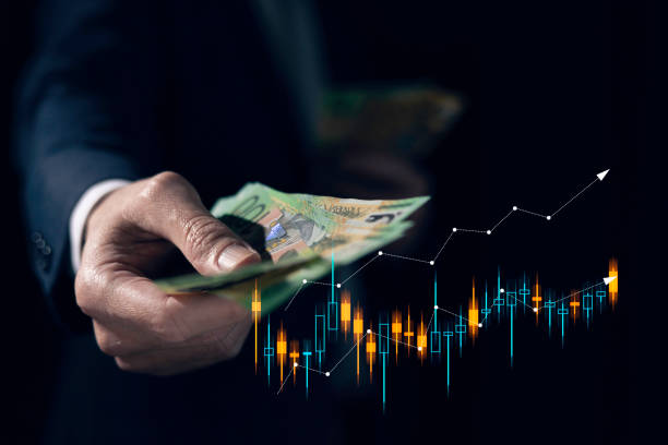 investment and finance concept, businessman holding virtual trading graph and blurred light on hand, stock market, profits and business growth. stock photo