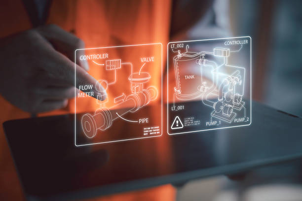 Industrial Manufacturing: Multiracial Technical Engineer Learning with Robot Arm Machine in a Factory Setting stock photo