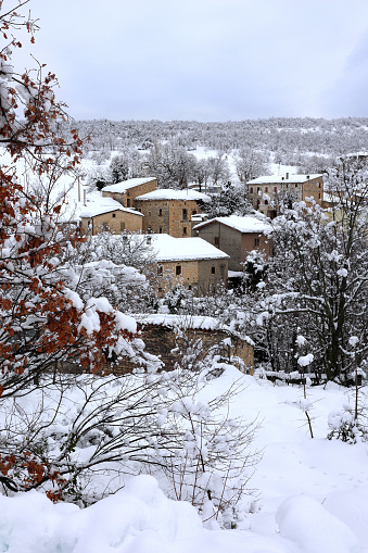 Abruzzo, Italy. Fresh snow covering the village of Decontra, near Caramanico Terme.  The small village, with it's row of stone houses, is part of the Majella National Park.