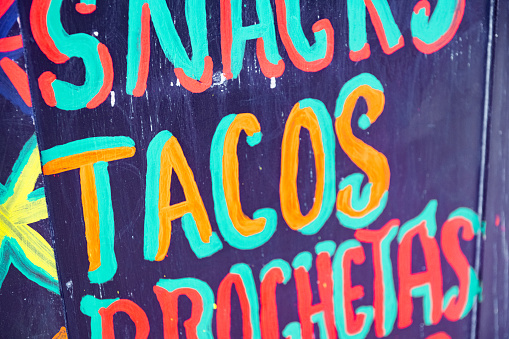 This is a close up hand lettered sign advertising tacos in Playa del Carmen, Mexico.