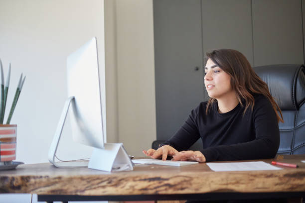 istock young girl enjoying technology with vr glasses at work 1915849272