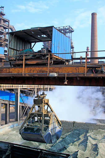 Iron ore powder stock ground in the steel mills, closeup of photo