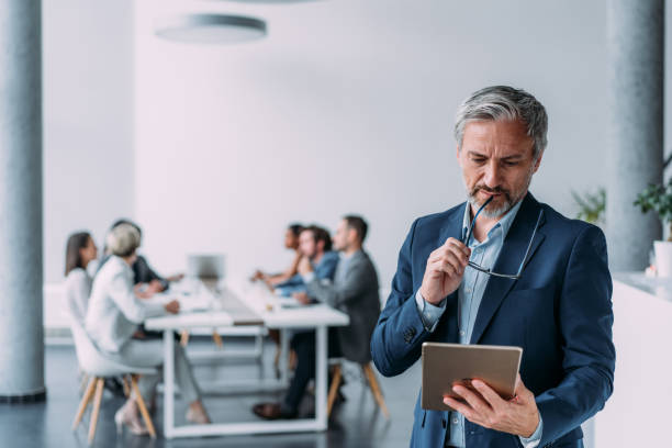 istock Confident businessman and his team. 1915928153