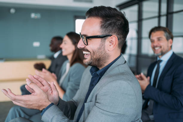 istock Businesspeople applauding during a seminar in conference hall. 1915929273