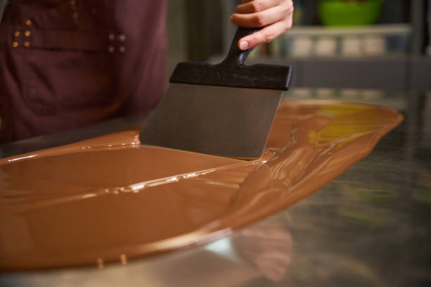 istock Experienced chocolatier is making candies on kitchen countertop 1915934548
