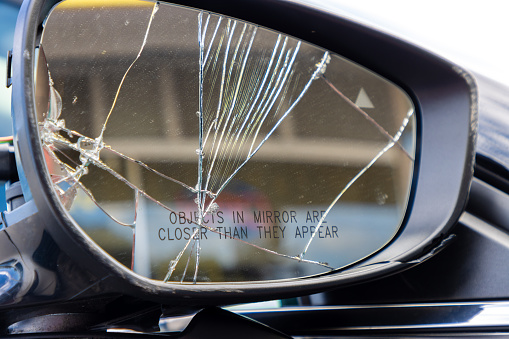 A cracked car mirror after a crash.
