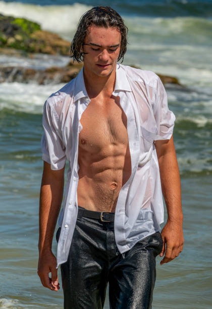 istock On a super hot day young man in surf in clothes. 1916081620