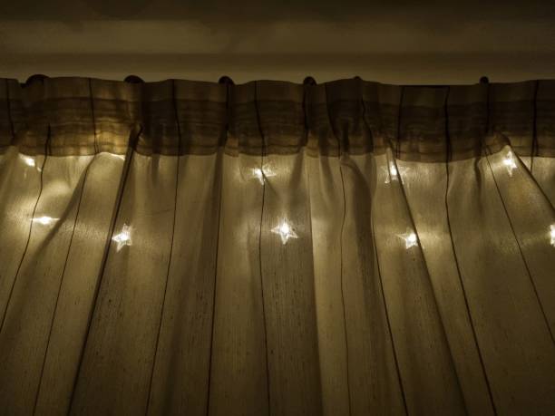 istock Glowing garland on the window 1916109178