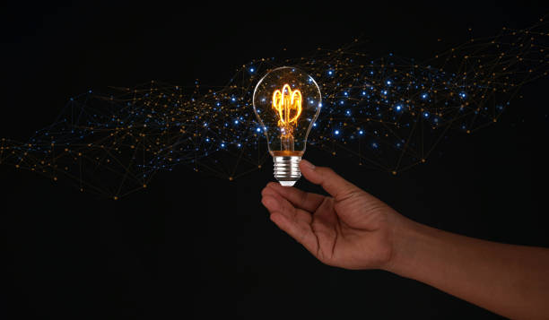 istock Creative solution or idea for web banner design or landing page template for creative agency with hands coming out of the screen with light bulbs and colorful abstract geometric shapes and lead lines. 1916118725