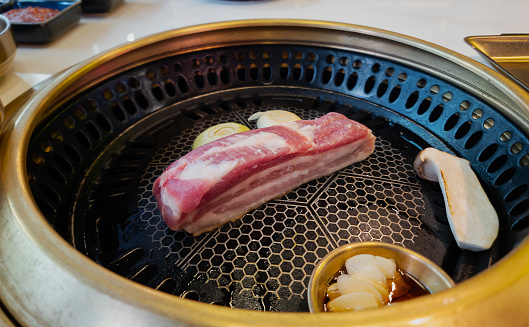 Korean food. Pork barbeque steak on the grill.
