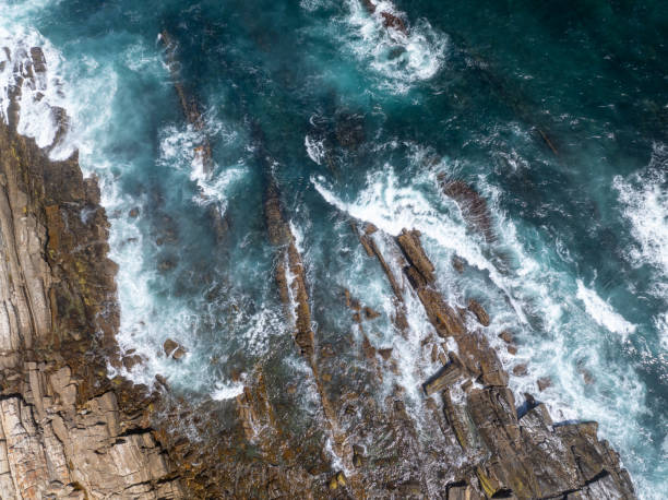 istock High angle view of water hitting rocks 1916192526