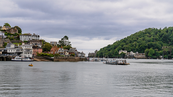 Dartmouth, Devon, England, UK - May 26, 2022: The Lower Ferry crosses the River Dart on its way to Kingswear