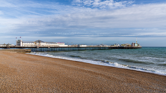 Brighton, East Sussex, England, UK - May 10, 2022: The beach and the Palace Pier