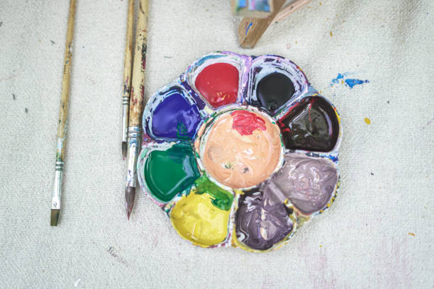 Equipment paint trays and brushes placed on the table