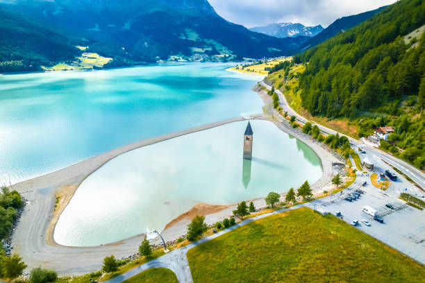 curon venosta. submerged bell tower in graun im vinschgau on lake reschen alpine landscape aerial view - 11915 foto e immagini stock