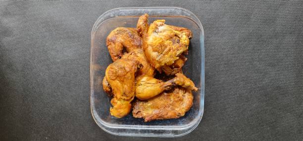 istock Several pieces of fried chicken are served in a clear rectangular plate. Fried chicken is a popular food. 1916240380
