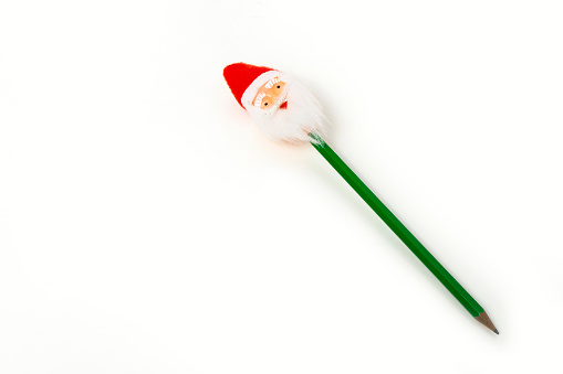 Santa on wooden pencil on isolated white background
