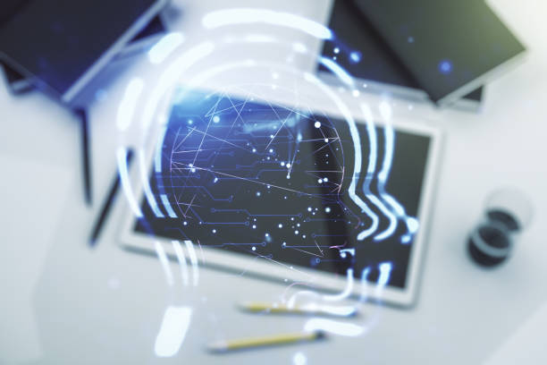 istock Creative artificial Intelligence concept with human head hologram and modern digital tablet on background, top view. Multiexposure 1916316444