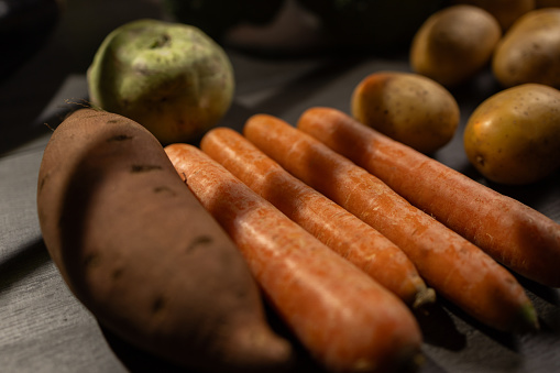 Close-up shot of of vegetables on wooden table without people