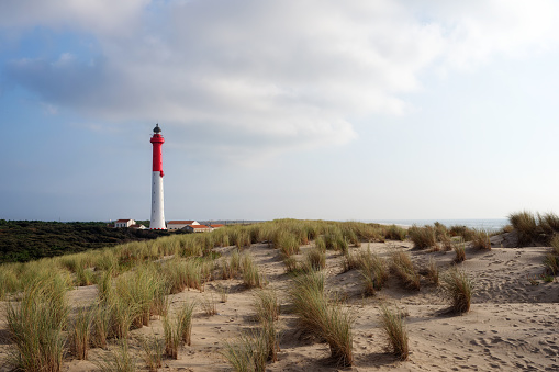 Red and whitr striped lighthouse and clear blue sky on island Sylt, Germany