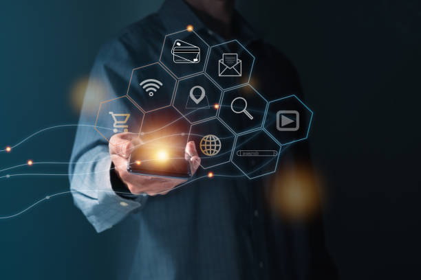 istock Businessman using smartphone futuristic infographics interface 1916351754