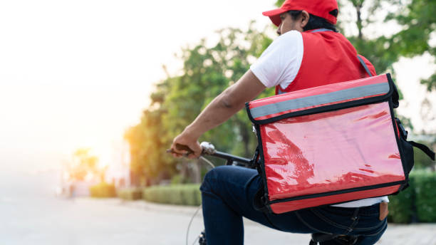 istock Food delivery man on bicycle, ready for work 1916426672