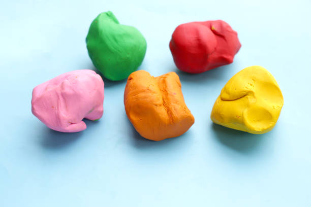 istock Colorful plasticine clay on blue background. 1916450627