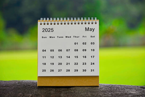 istock May 2025 white calendar with green blurred background - New year concept 1916462681