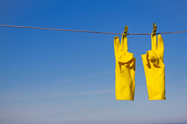 Different clothes drying on washing line against blue sky