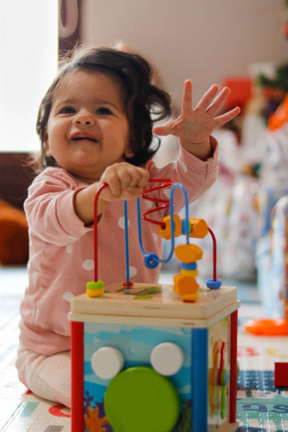 istock Baby plays with a smile 1916501172