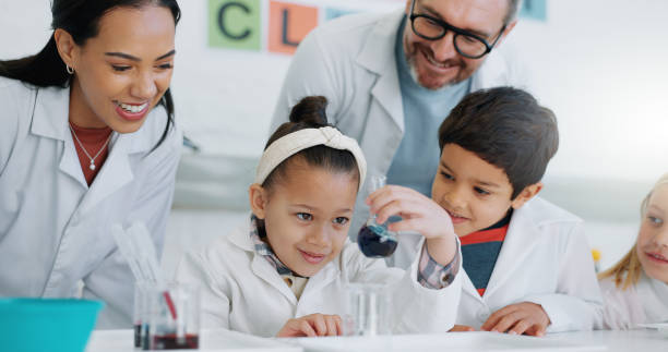 istock Science, education and students in a classroom with their teachers for learning or to study chemistry. Children, school and scholarship with kids in a lab for an experiment of chemical reaction 1916552092