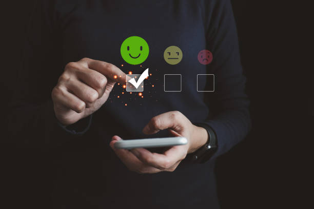 istock Customers evaluate satisfaction service by smartphone, caring and paying attention to service users, check box the best smile icon, very good response and feedback from customers. 1916560493