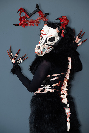 A female cosplayer dressed as a skeleton monster