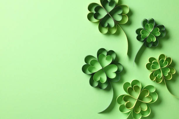 istock Four leaf clover paper cut on green background. St Patrick's Day holiday card. 1916604363