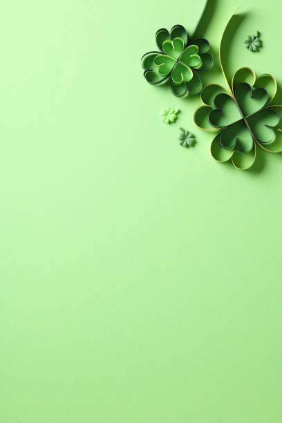 istock St patrick's day background with paper cut clover leaf on bright green background. 1916607028
