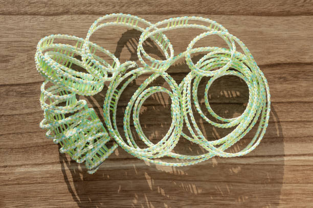 top view green plastic clothesline on a wood table