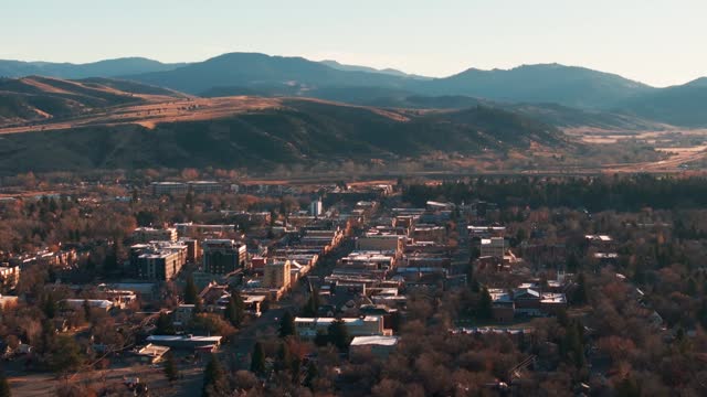 Static drone shot viewing downtown Bozeman, Montana at sunrise in the fall