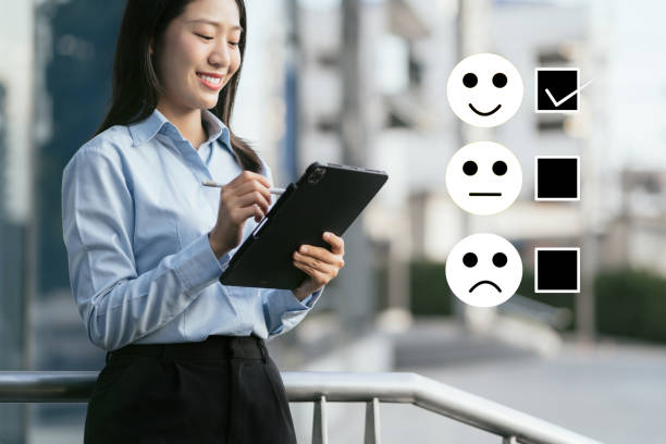 istock User give rating to service experience on online application smartphone and Tablet. 1916661327