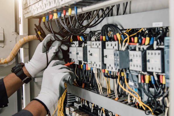 istock Electrician engineer tests electrical installations and wires on relay protection system. 1916698835