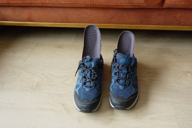 istock Orthopedic insoles in shoes on floor 1916719328