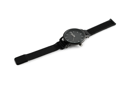 Women's wristwatch black. Close-up. Isolated on white background.