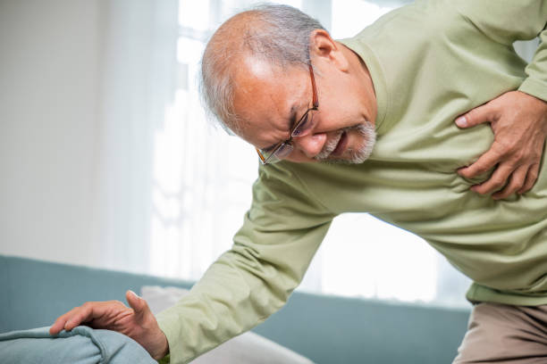 istock Sad senior man feeling bad pain use hand touching chest having heart attack 1916760088