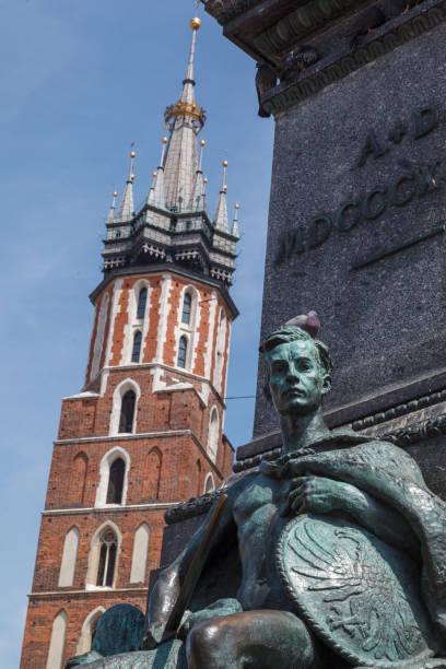 istock Adam Mickiewicz Monument and the facade of St Mary Basicila Krakow, Poland 1916807160