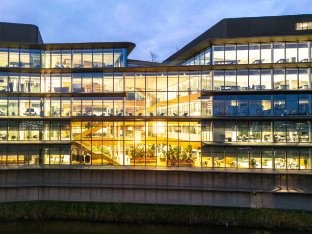 Office block with lots of lit up windows. City of Leiden business area in dusk.